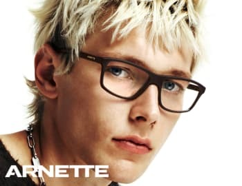 A young man looking stylish with Puma sunglasses
