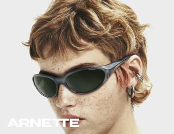 A young man looking stylish with Puma sunglasses