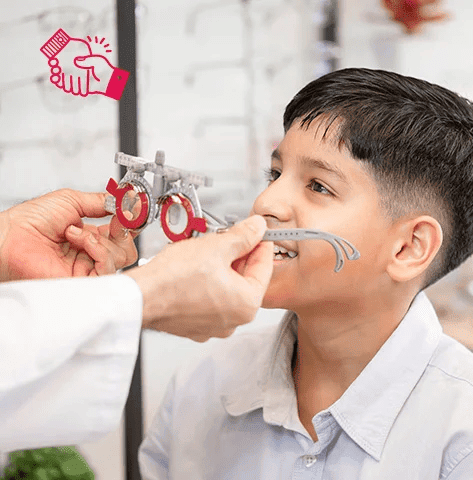 Optometrist fitting HOYA MiYOSMART lenses on a young patient 