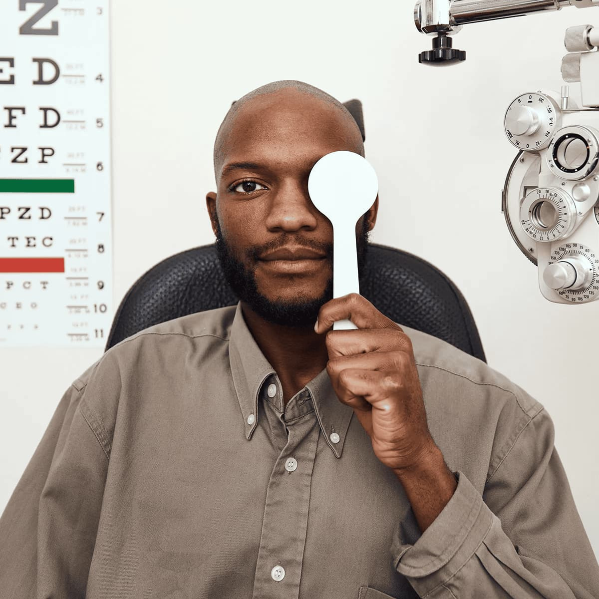 A man receiving a vision screening test