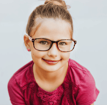 A young girl with her new prescription glasses