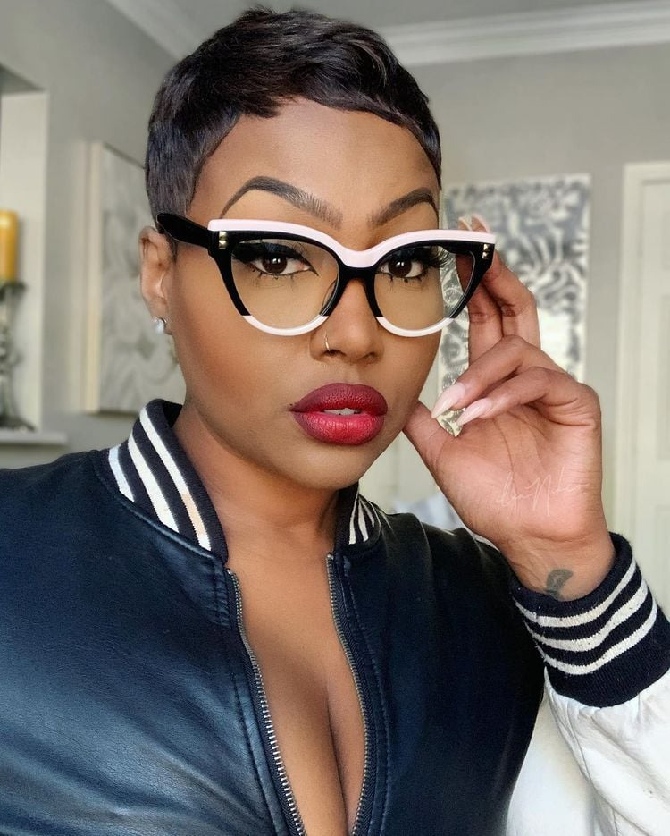Confident woman wearing myopia-control lenses, showcasing clear vision and modern eyewear style.
