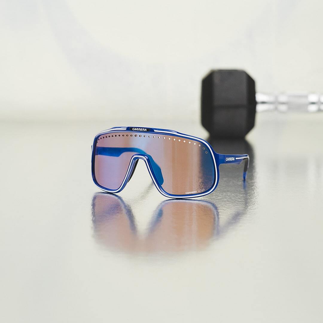 Detailed close-up of modern unisex Carrera sunglasses with sleek frame design.