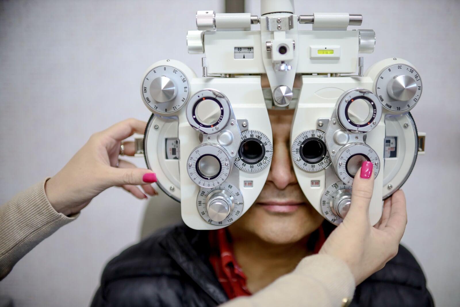 Optometrist performing an eye screening test at a Dynamic Vision practice in South Africa.