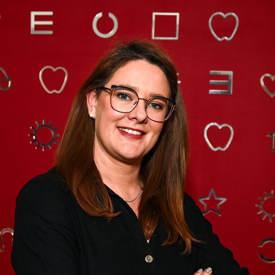 A window display of a women wearing prescription spectacles